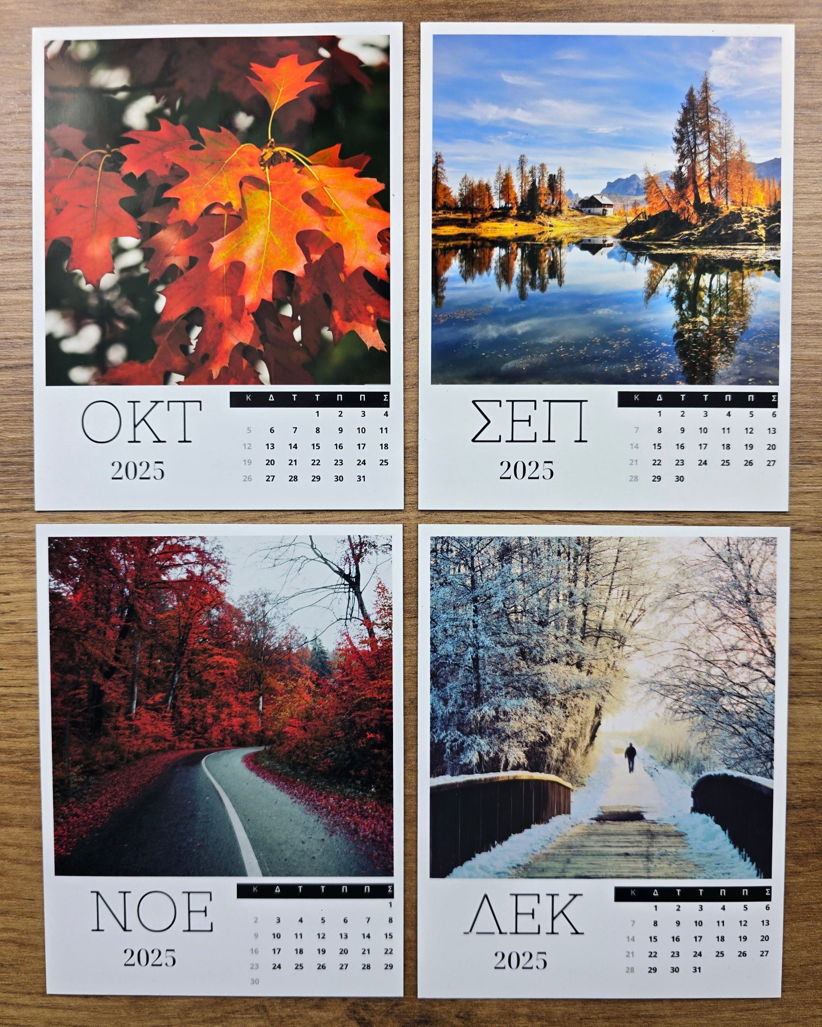 Four photo magnet calendar pages showing autumn and winter scenes on a wooden surface.