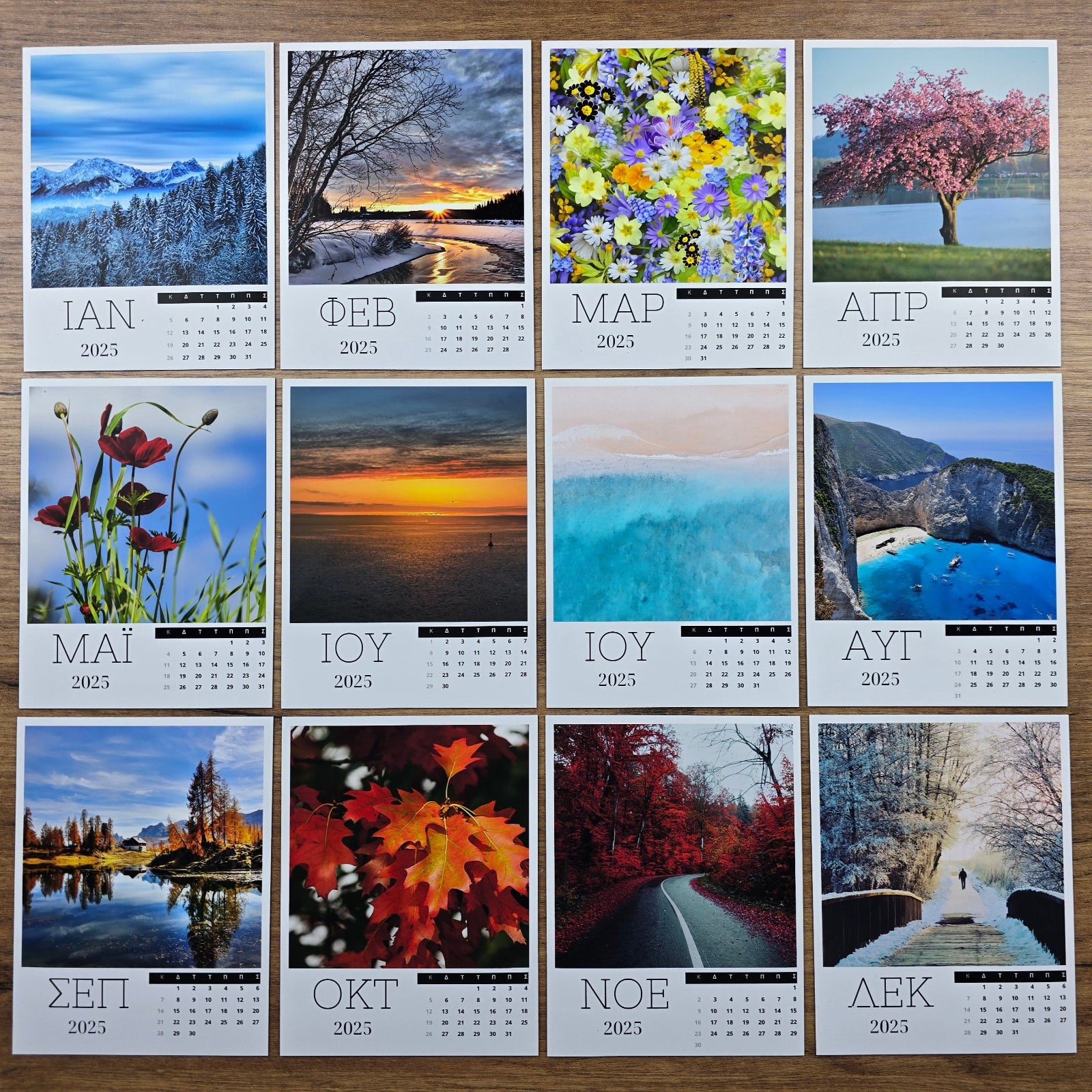 Photo magnet calendar with scenic images of various months on a wooden surface